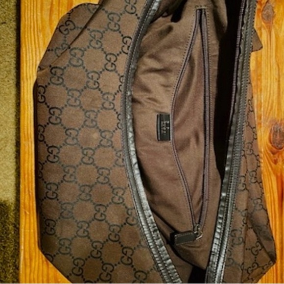 I’m selling a tan and brown Gucci overnight bag. - Picture 4 of 6